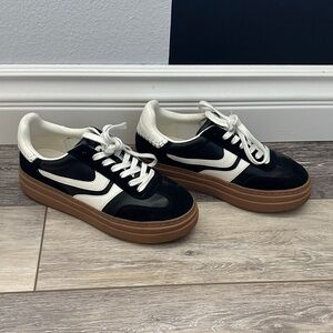 Steve Madden. Lightly worn Black and White Sneakers with Brown Soles